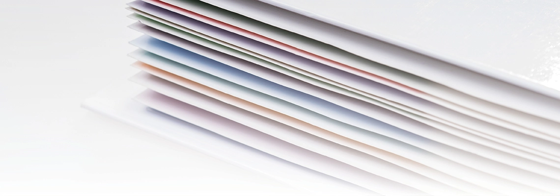 A close-up photograph of an open book, focusing on the edges of the pages.