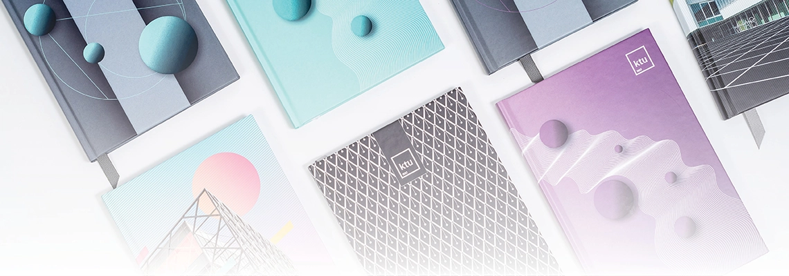 A top-down photograph of seven books with colorful covers arranged on a table.